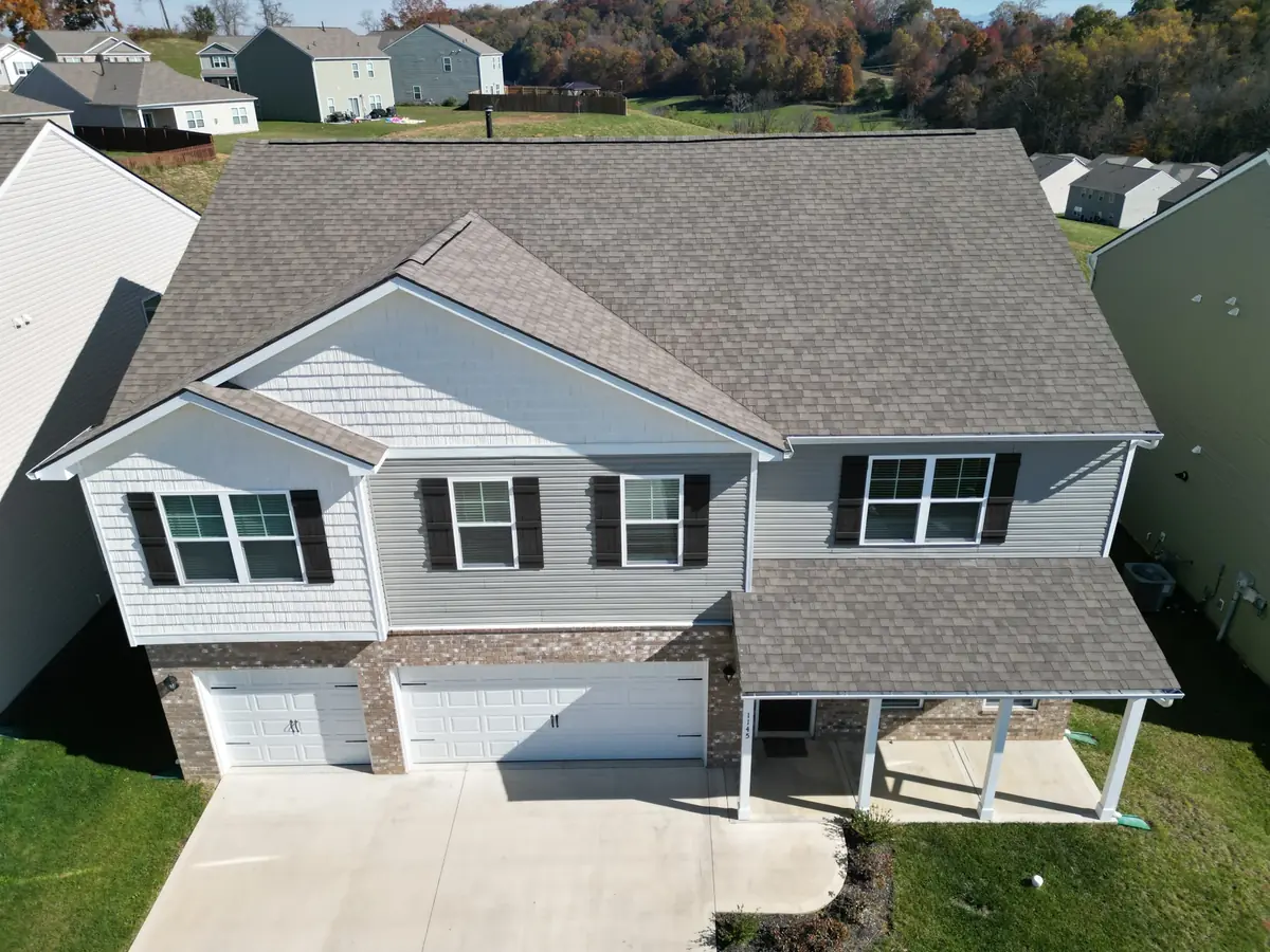Aerial photograph of a completed Palisade Roofing residential project.